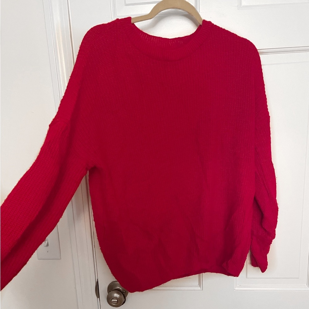 Baggy red sweater. Size is small